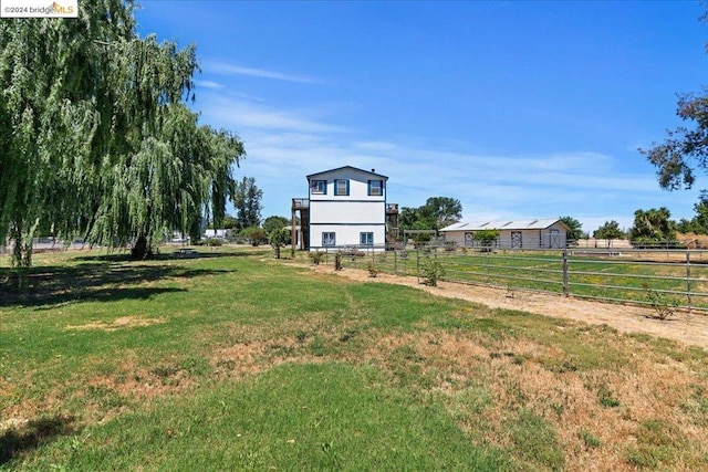 view of yard with a rural view