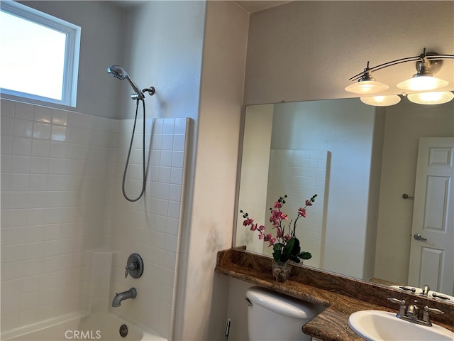 full bathroom featuring vanity, shower / bath combination, and toilet