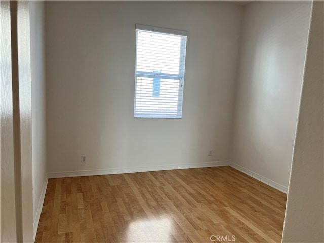 spare room featuring light wood-type flooring