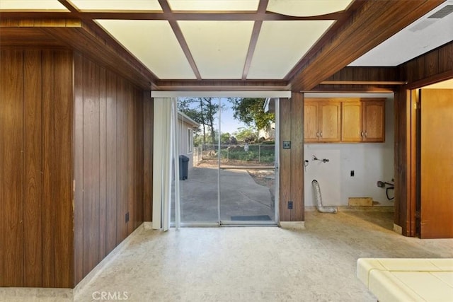 entryway featuring wooden walls