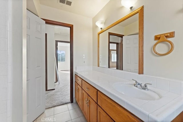 bathroom featuring visible vents, tile patterned floors, and vanity