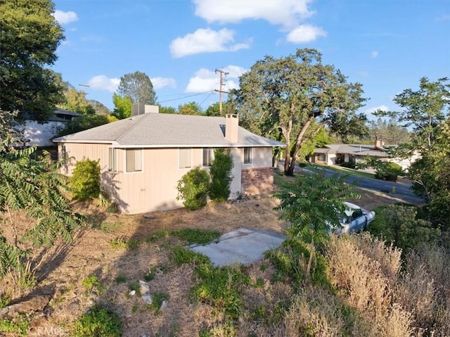view of side of property featuring a chimney