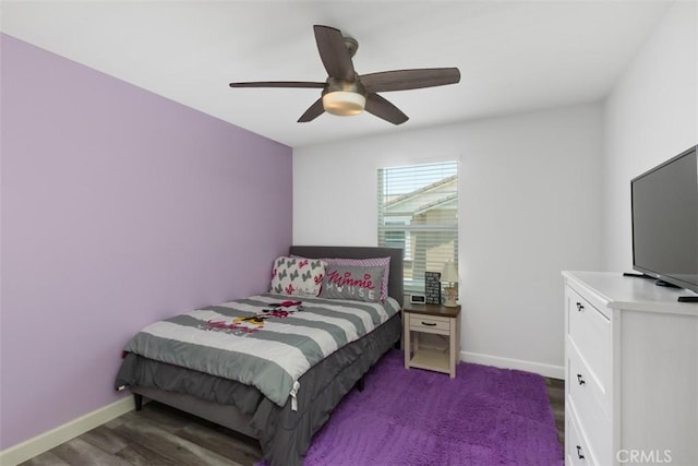 bedroom featuring ceiling fan and dark hardwood / wood-style floors