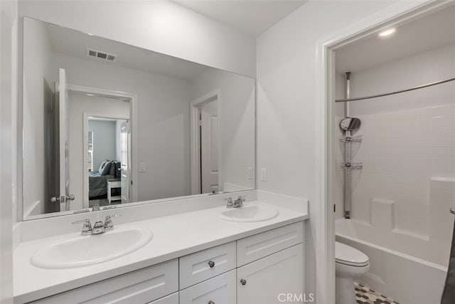 full bathroom with vanity,  shower combination, and toilet