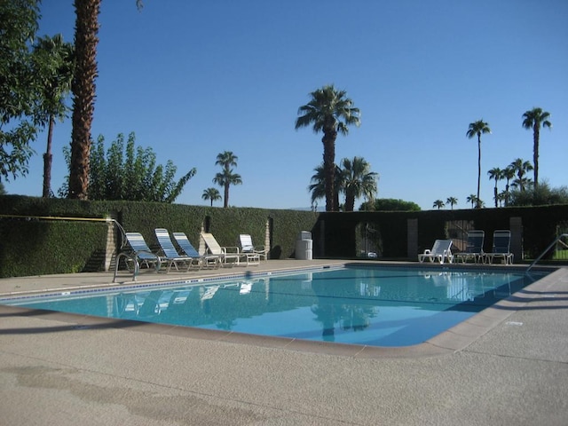 view of swimming pool featuring a patio area