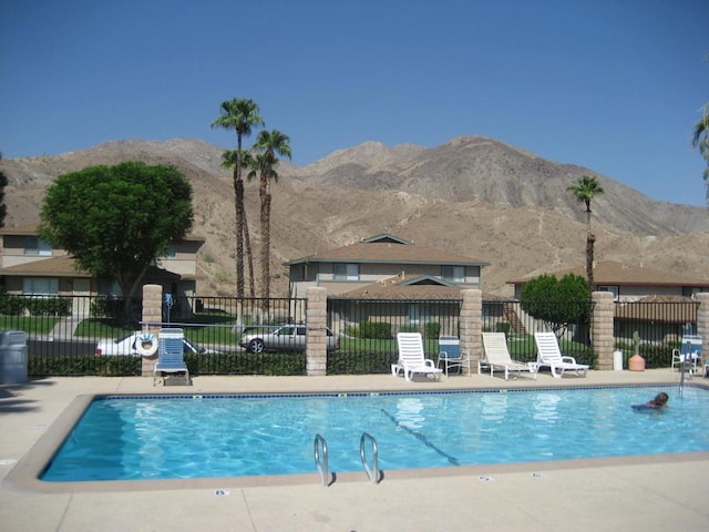 view of pool with a mountain view