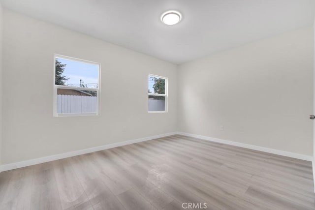 unfurnished room featuring light hardwood / wood-style floors