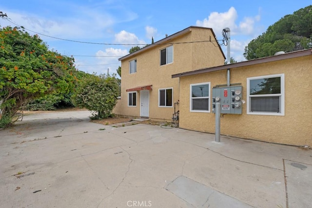 rear view of house with a patio