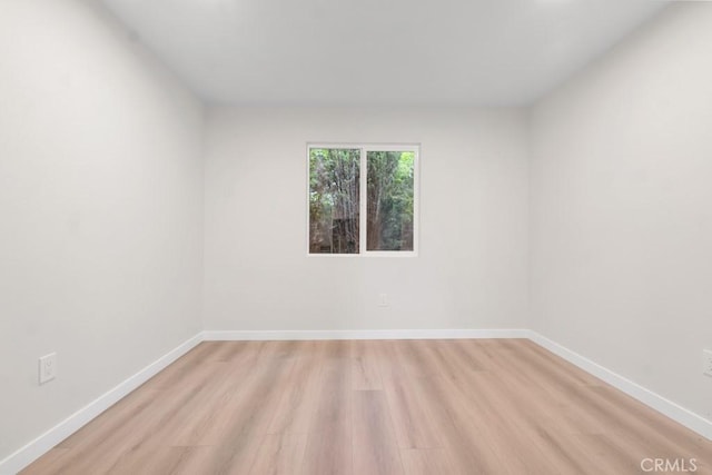 spare room with light wood-type flooring