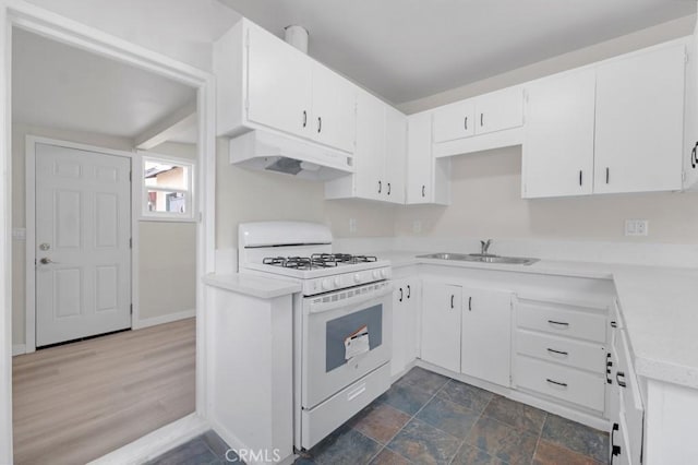 kitchen featuring dark wood-type flooring, sink, white cabinets, and white range with gas stovetop