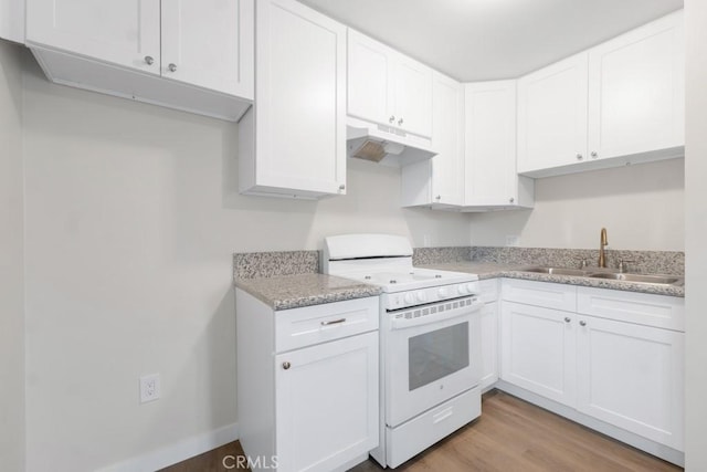 kitchen with light stone counters, white range, sink, light hardwood / wood-style flooring, and white cabinets