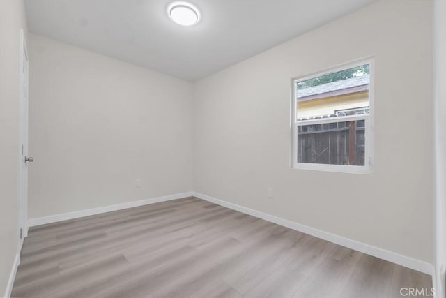 spare room with light hardwood / wood-style floors