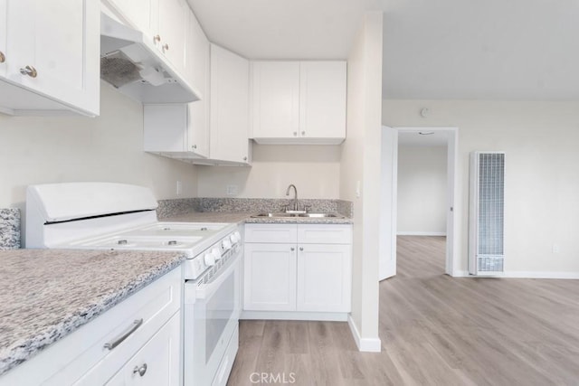 kitchen with light stone countertops, white cabinetry, sink, light hardwood / wood-style floors, and white stove