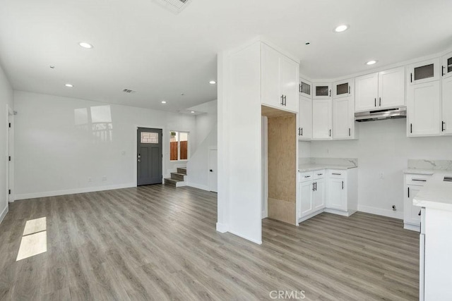 kitchen featuring white cabinetry and light hardwood / wood-style flooring