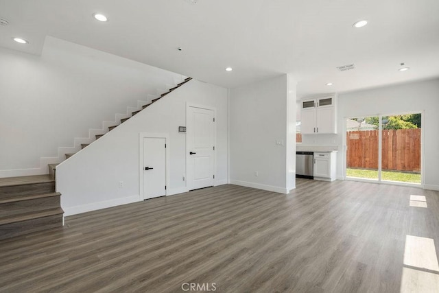 unfurnished living room featuring dark hardwood / wood-style flooring