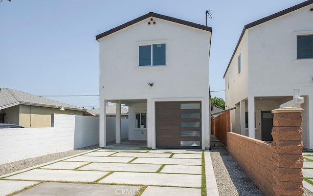 rear view of house with a patio