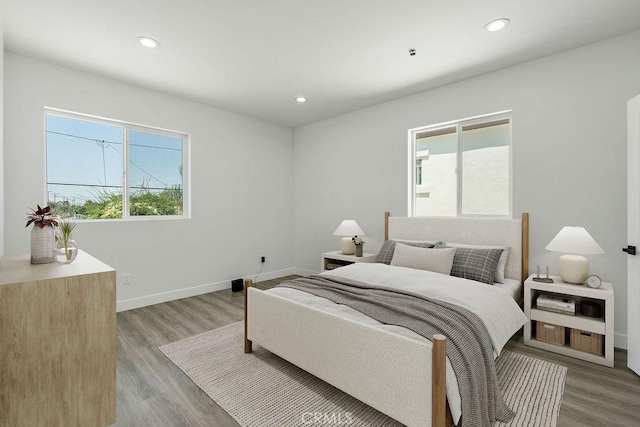 bedroom with light hardwood / wood-style floors