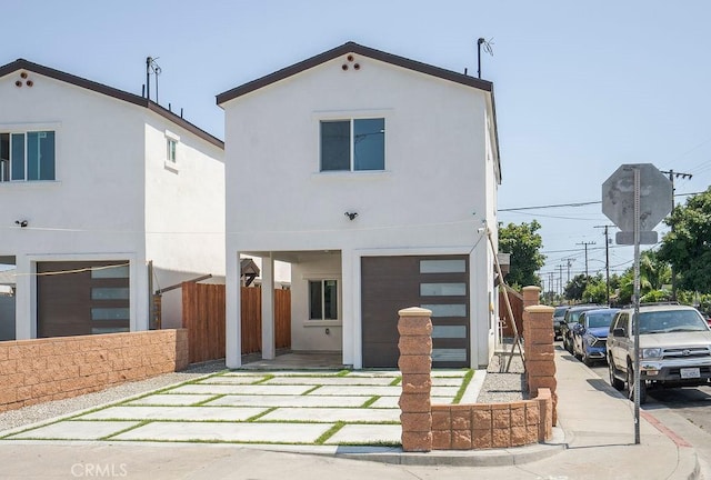 rear view of property featuring a garage