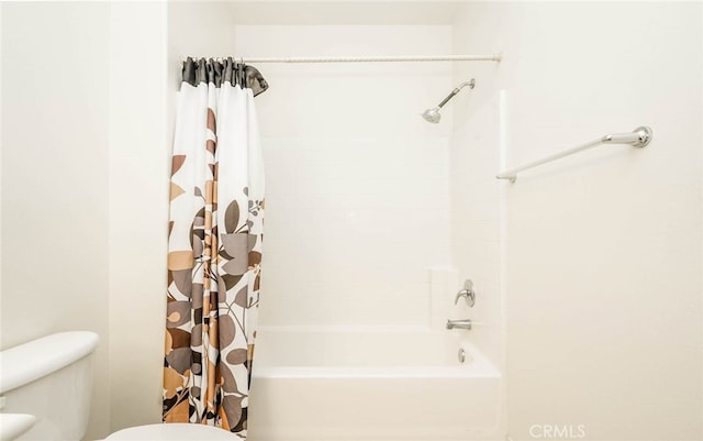 bathroom featuring toilet and shower / bathtub combination with curtain