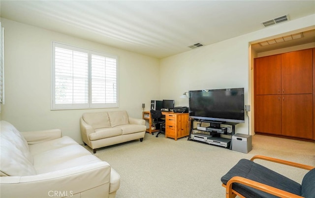 living room featuring light colored carpet