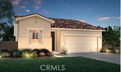 mediterranean / spanish-style house featuring a garage and a front lawn