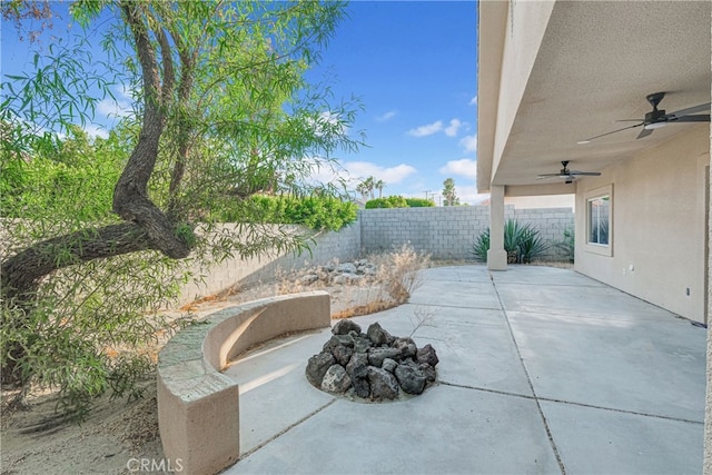 view of patio featuring ceiling fan