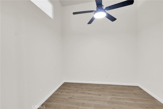 spare room with ceiling fan and light wood-type flooring