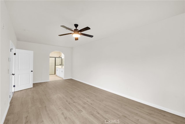 unfurnished room with ceiling fan and light wood-type flooring