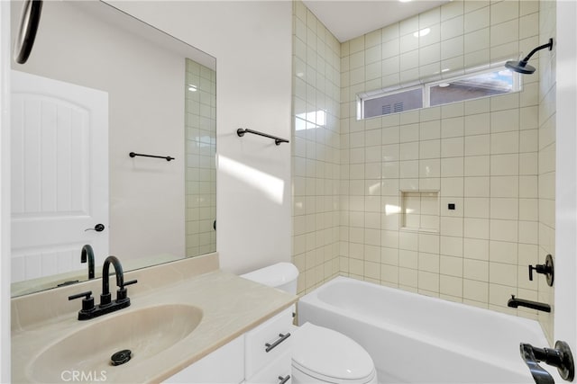 full bathroom featuring toilet, vanity, and washtub / shower combination