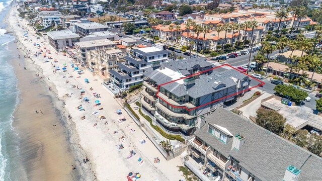 aerial view featuring a water view and a beach view