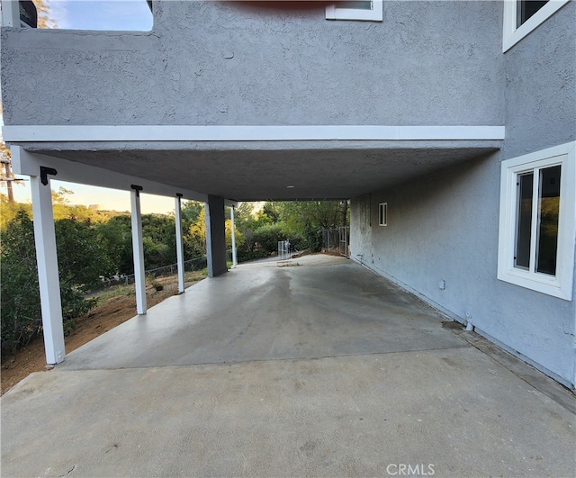 view of vehicle parking with a carport