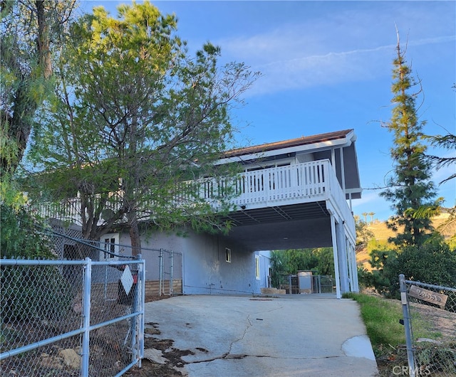 front facade with a wooden deck