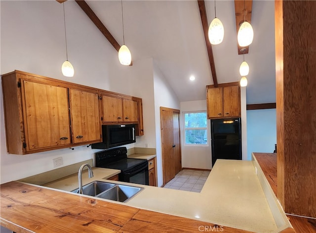 kitchen with kitchen peninsula, beam ceiling, black appliances, sink, and decorative light fixtures