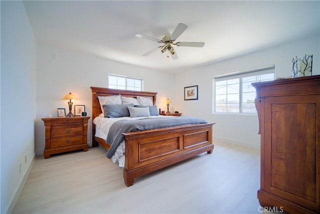 bedroom featuring light hardwood / wood-style floors and ceiling fan