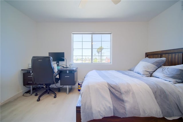 bedroom featuring light hardwood / wood-style floors and ceiling fan