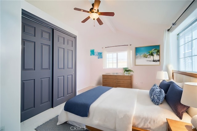 bedroom with tile patterned flooring, a closet, multiple windows, and ceiling fan