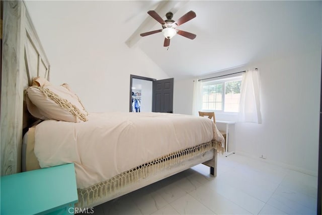 bedroom with ceiling fan, a closet, a spacious closet, and vaulted ceiling