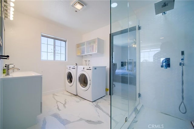 laundry room featuring separate washer and dryer and sink