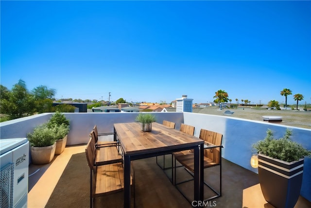 view of patio featuring a balcony