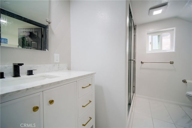 bathroom with walk in shower, tile patterned flooring, vaulted ceiling, toilet, and vanity