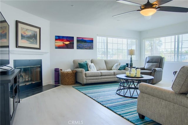 living room with hardwood / wood-style floors and ceiling fan