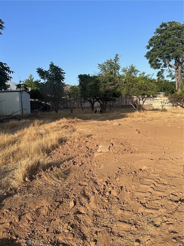 view of yard with a rural view