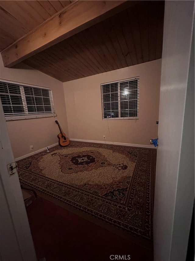 interior space featuring wood ceiling and lofted ceiling with beams