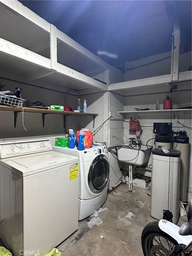 washroom with washing machine and clothes dryer