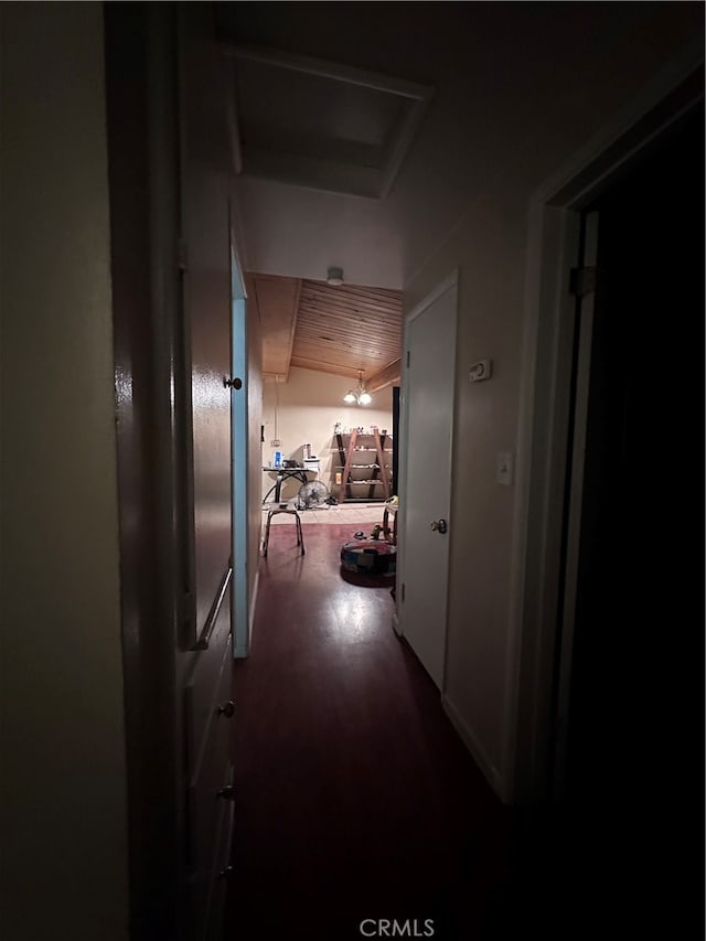 hall featuring wood ceiling and hardwood / wood-style floors