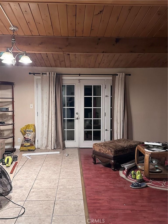 interior space featuring french doors, wood ceiling, tile patterned floors, and beam ceiling