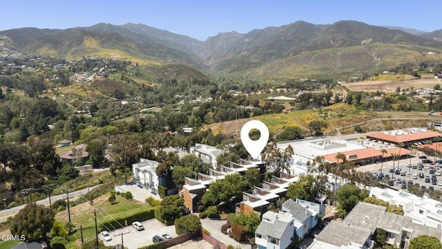 birds eye view of property with a mountain view