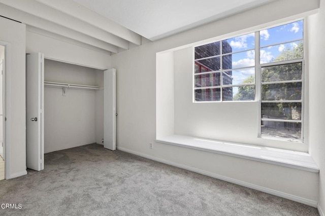 unfurnished bedroom with light colored carpet