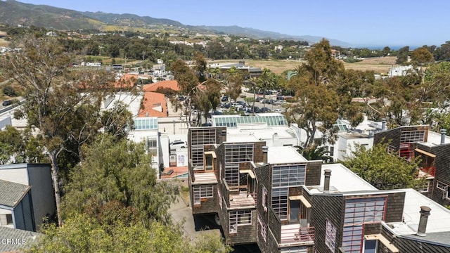 birds eye view of property featuring a mountain view