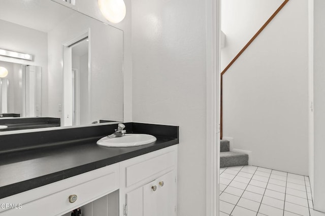 bathroom with tile patterned flooring and vanity